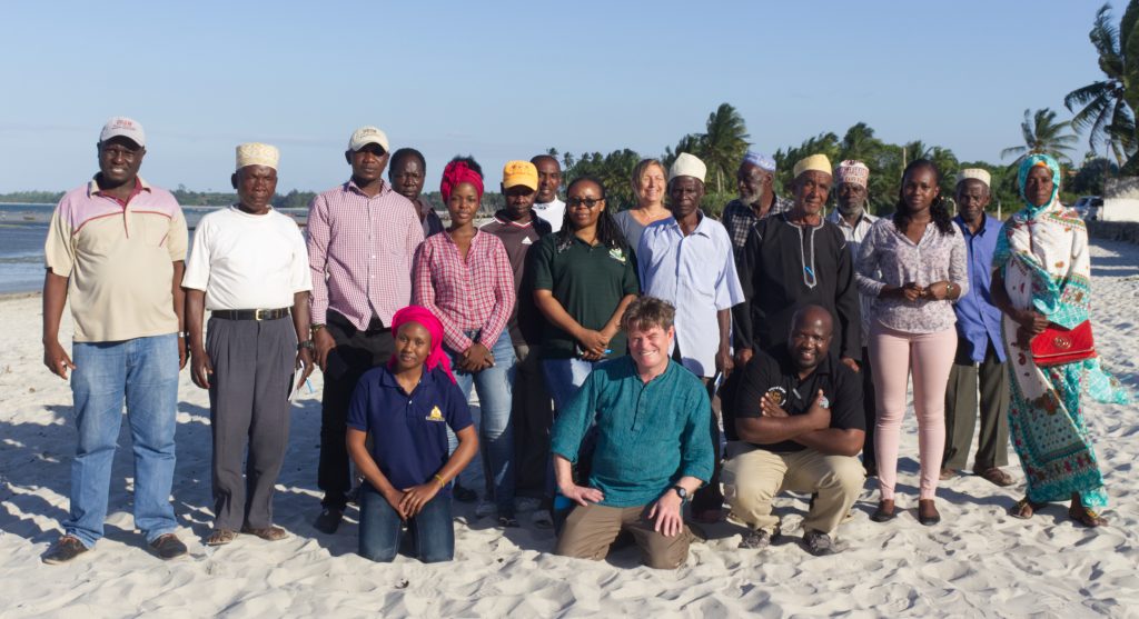 Members of the Bahari Yetu, Urithi Wetu project team, together with fishers, boat-builders and spiritual practitioners, at a project co-creation event aimed at identifying the key issues faced by the community (Image: unknown photographer)